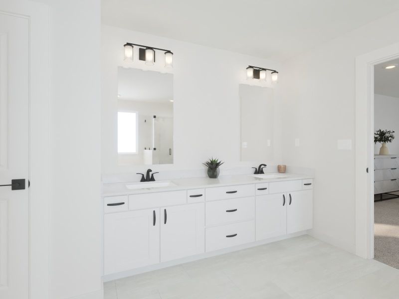 The primary bathroom offers dual vanity sinks and a walk-in shower.