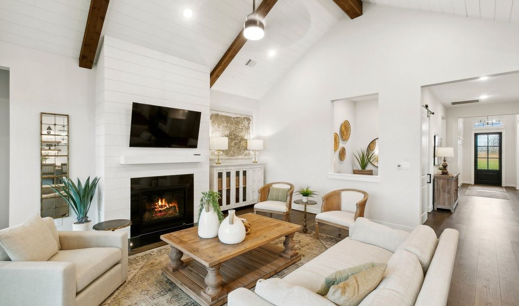 Great room with fireplace and stained ceiling beams