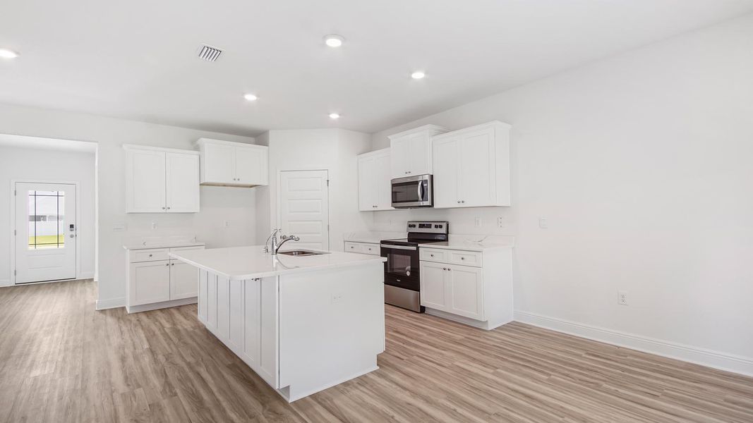 Furnished interior view inside a new home in Bayside at Ward Creek, Panama City Beach (Image 7).