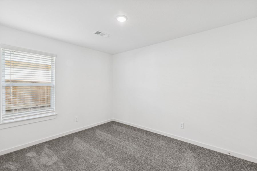 Spacious, unfurnished interior of a new home in Pinewood at Grand Texas, New Caney (Image 7).