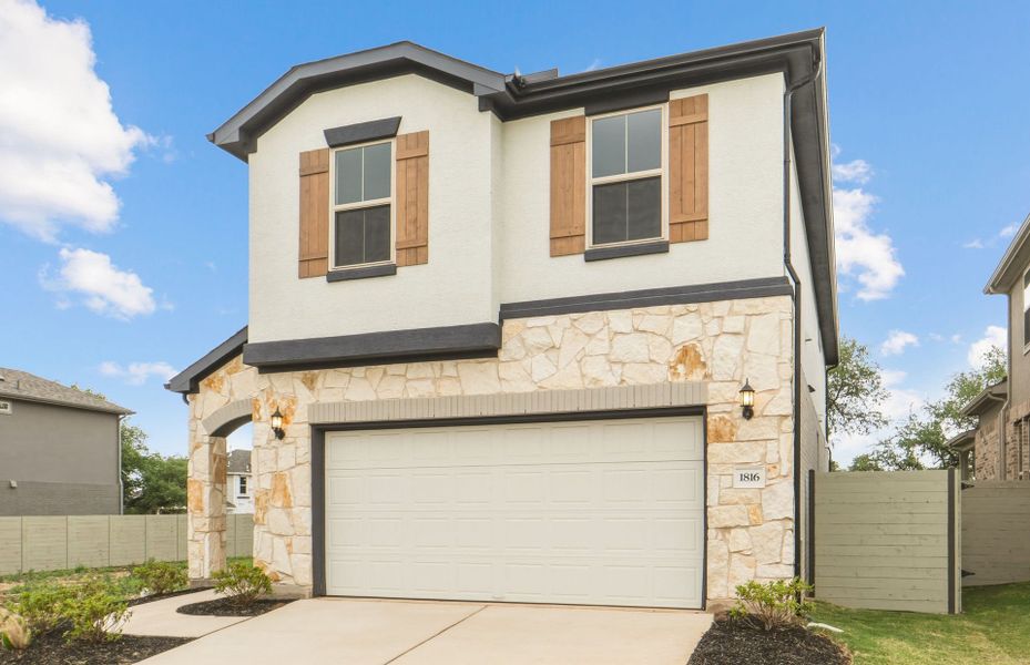 Front exterior of a new home in Wolf Ranch, Georgetown, TX, highlighting curb appeal (Image 24). Front exterior of a new home in Wolf Ranch, Georgetown, TX, highlighting curb appeal (Image 24).