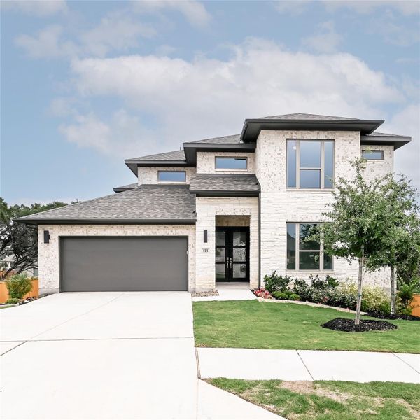 Front exterior of a new home in 6 Creeks, Kyle, TX, highlighting curb appeal (Image 13).