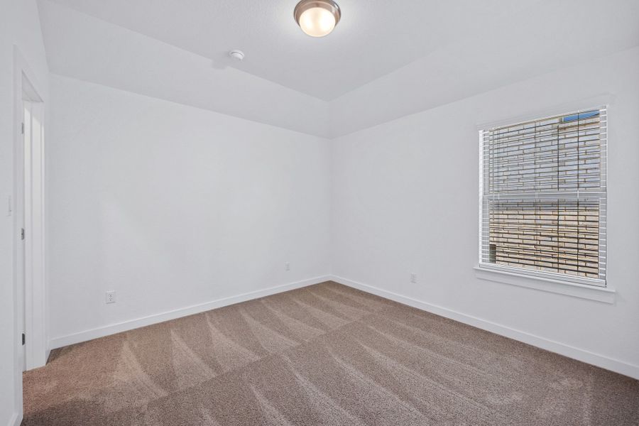 Bedroom in the Mesquite home plan by Trophy Signature Homes – REPRESENTATIVE PHOTO Bedroom in the Mesquite home plan by Trophy Signature Homes – REPRESENTATIVE PHOTO