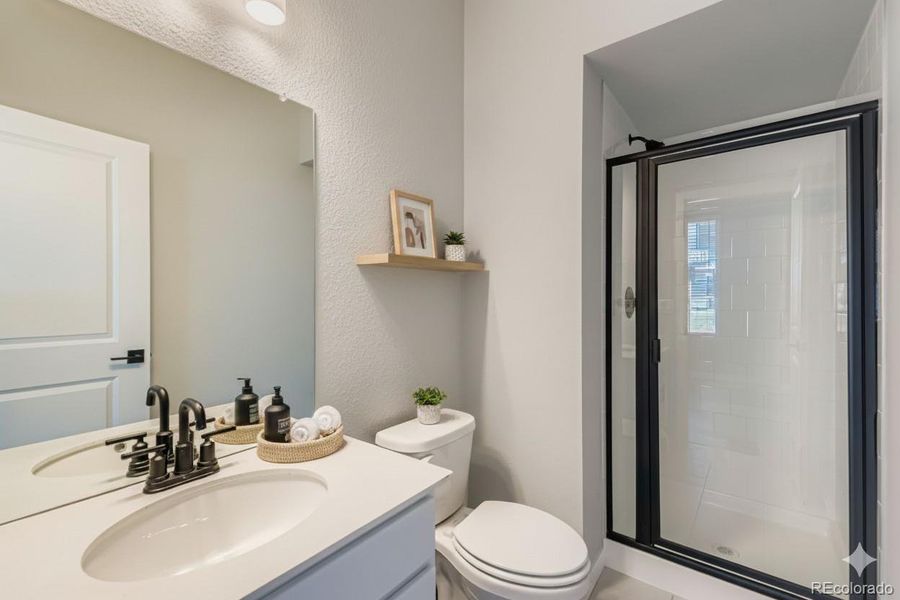 Main level bathroom. Photos are not of actual home.