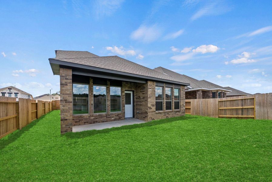 Exterior details and patio area of a home in The Trails, New Caney (Image 17).