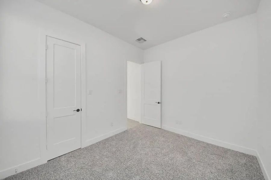 Representative unfurnished interior of a home built from the Bonneville by Chesmar Homes in Meridiana 50's and 60's, Manvel (Image 20).