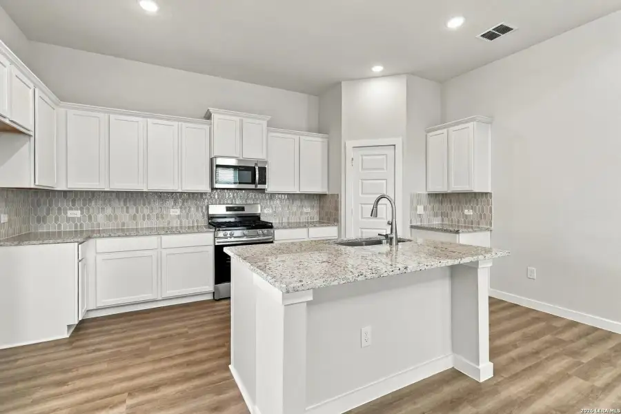 Furnished interior view inside a new home in Hunters Ranch, San Antonio (Image 5).