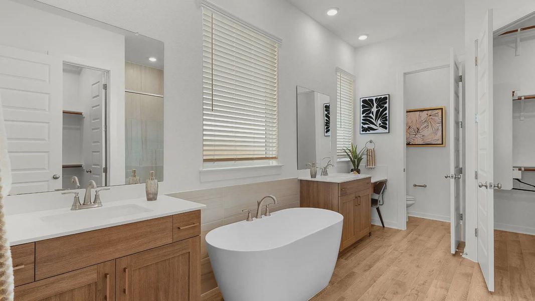 Representative furnished interior of a home built from the Lauren by Chesmar Homes in University Heights, Round Rock (Image 13).