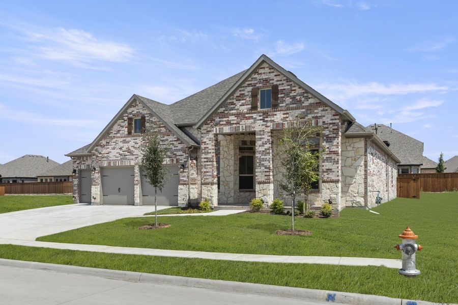 Front exterior of a new home in River Ranch, Van Alstyne, TX, highlighting curb appeal (Image 2).