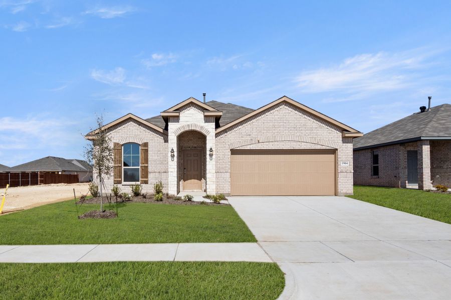 Front exterior of a new home in Baker Farms, Cleburne, TX, highlighting curb appeal (Image 2). Front exterior of a new home in Baker Farms, Cleburne, TX, highlighting curb appeal (Image 2).