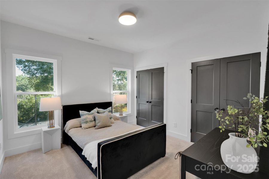 Guest bedroom with double closets