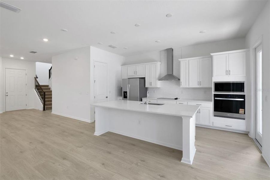 Furnished interior view inside a new home in Serenade at Ovation, Winter Garden (Image 9).