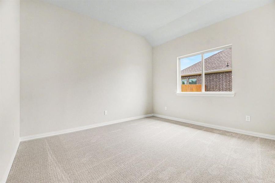 Neutral-toned room featuring light-colored walls and wall-to-wall carpeting Neutral-toned room featuring light-colored walls and wall-to-wall carpeting
