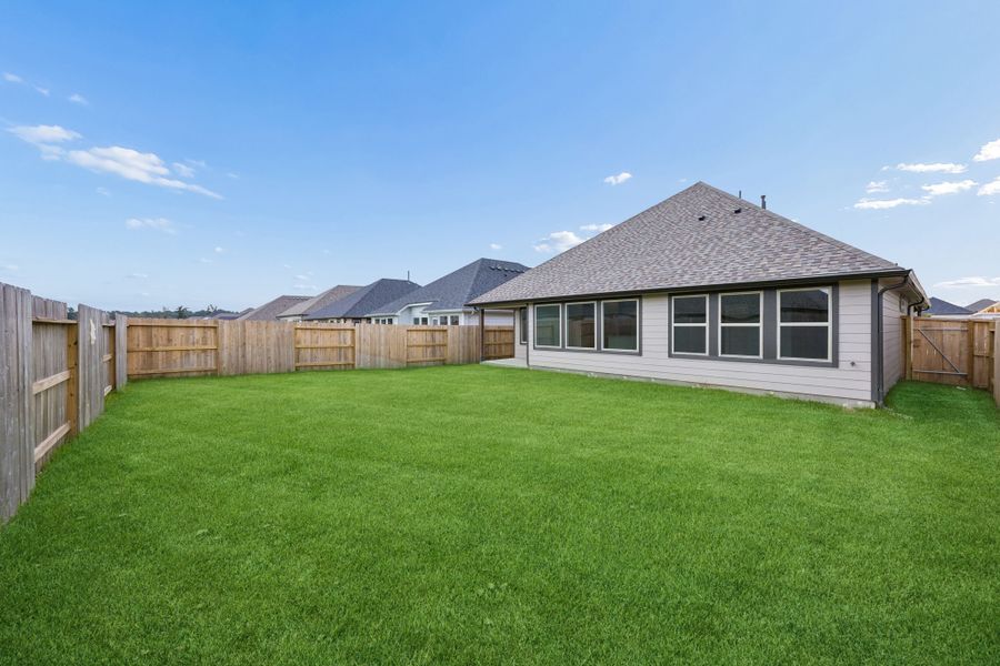 Exterior details and patio area of a home in Riviera Pines, Huffman (Image 21).