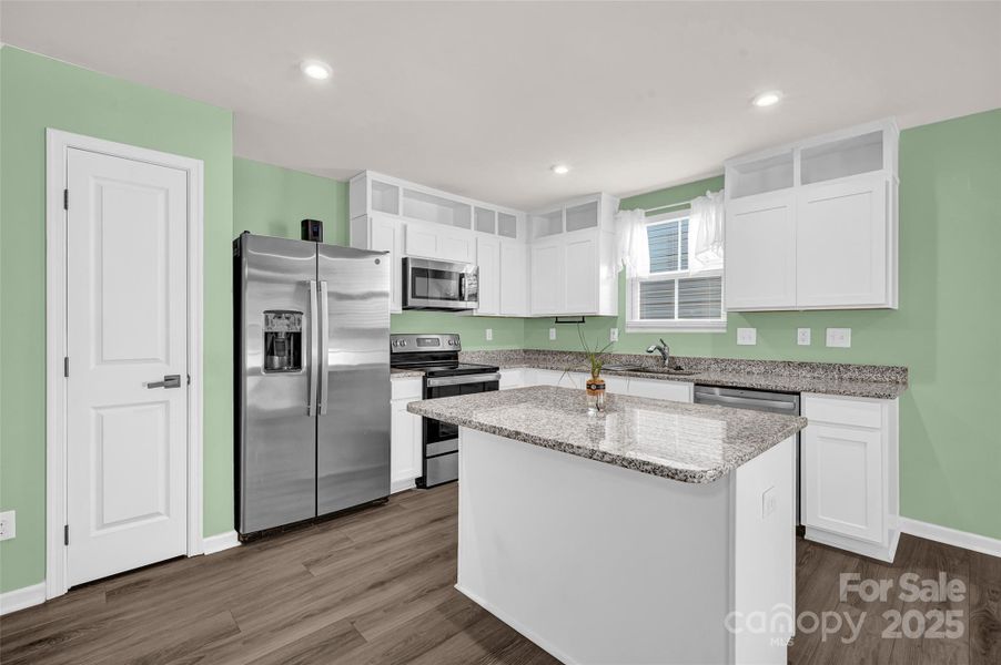 Kitchen area off of family room and patio