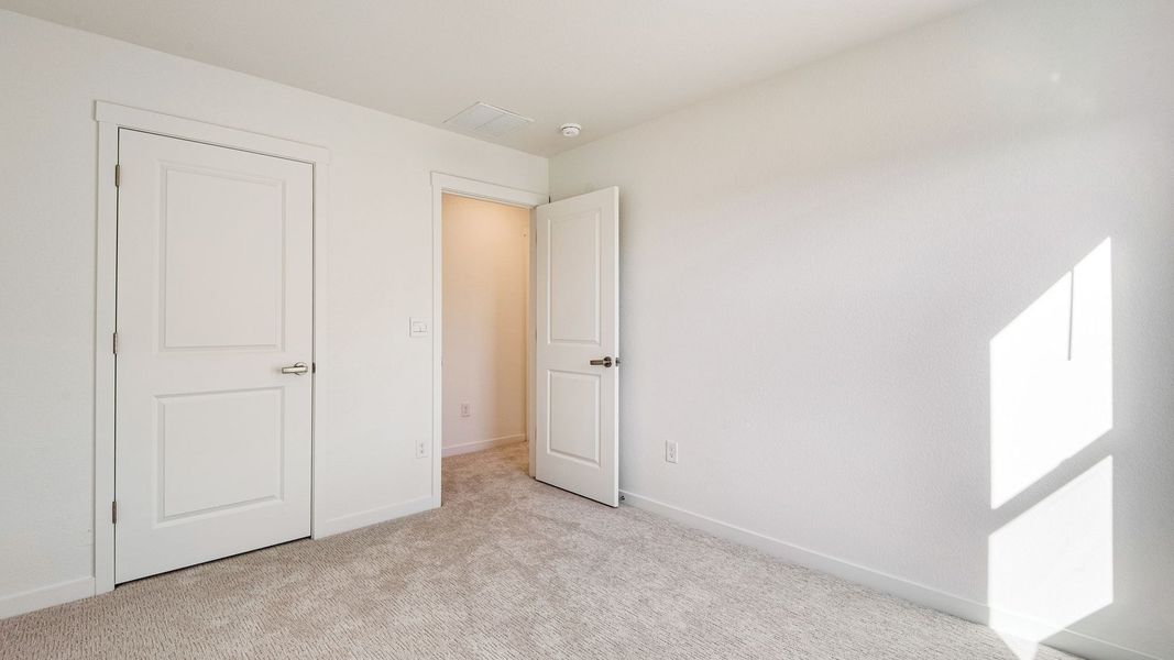 Spacious, unfurnished interior of a new home in Trails at Crowfoot, Parker (Image 27).