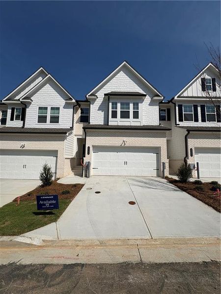 Front exterior of a new home in , Doraville, GA, highlighting curb appeal (Image 1). Front exterior of a new home in , Doraville, GA, highlighting curb appeal (Image 1).