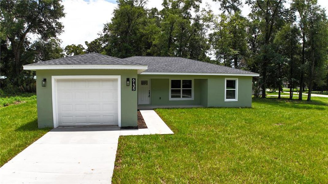 Front exterior of a new home in , Ocala, FL, highlighting curb appeal (Image 24). Front exterior of a new home in , Ocala, FL, highlighting curb appeal (Image 24).