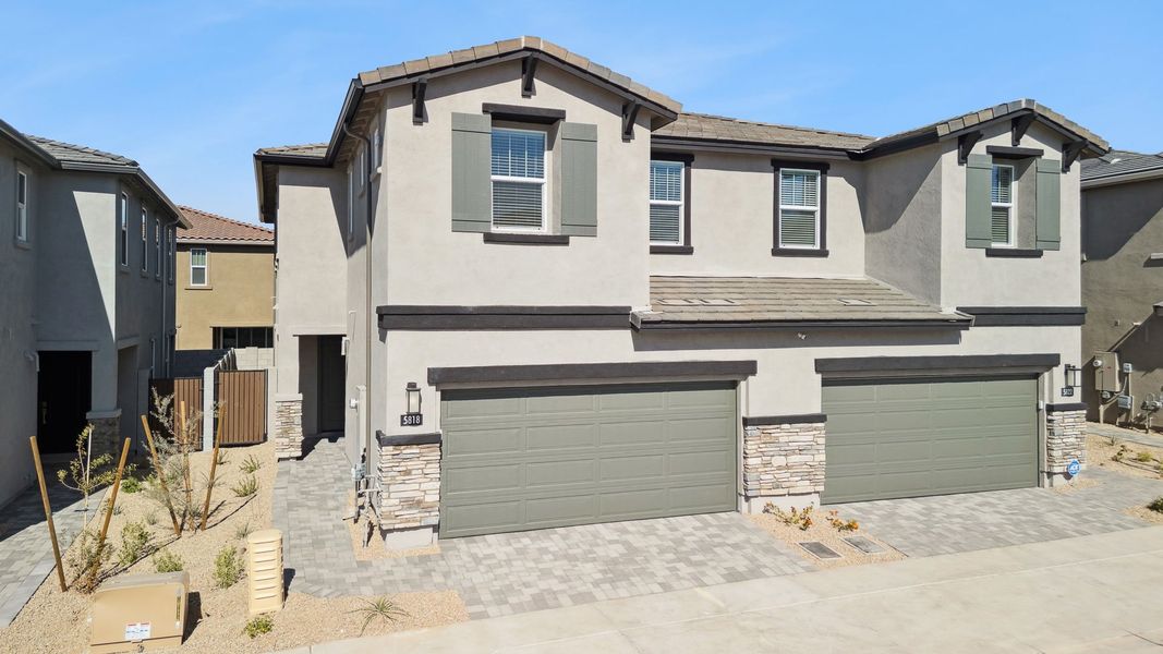 Front exterior of a new home in Talinn Towns at Desert Ridge, Phoenix, AZ, highlighting curb appeal (Image 2).