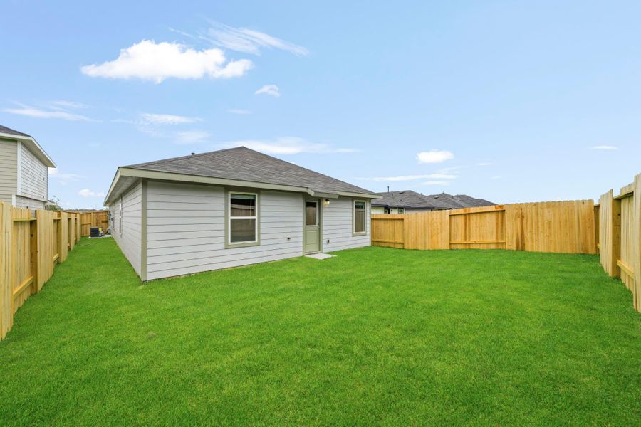 Exterior details and patio area of a home in The Canopies, Splendora (Image 4).