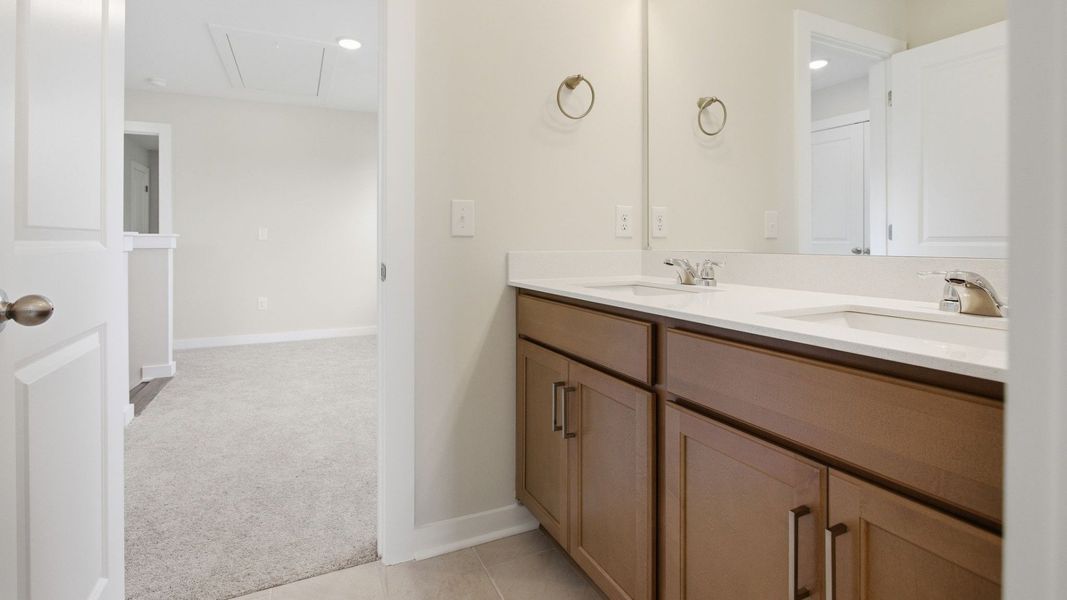 Bathroom with dual vanity and access to second floor Bathroom with dual vanity and access to second floor