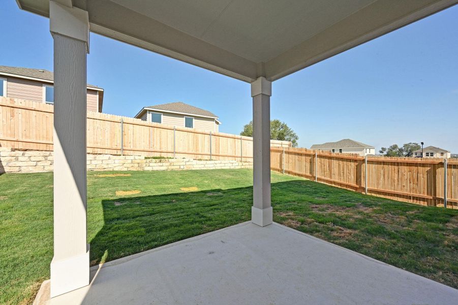 Exterior details and patio area of a home in Creekside at Estancia, Austin (Image 17).