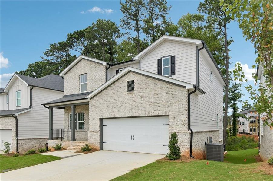 Front exterior of a new home in Martin Springs - Estate Series, Lawrenceville, GA, highlighting curb appeal (Image 24).