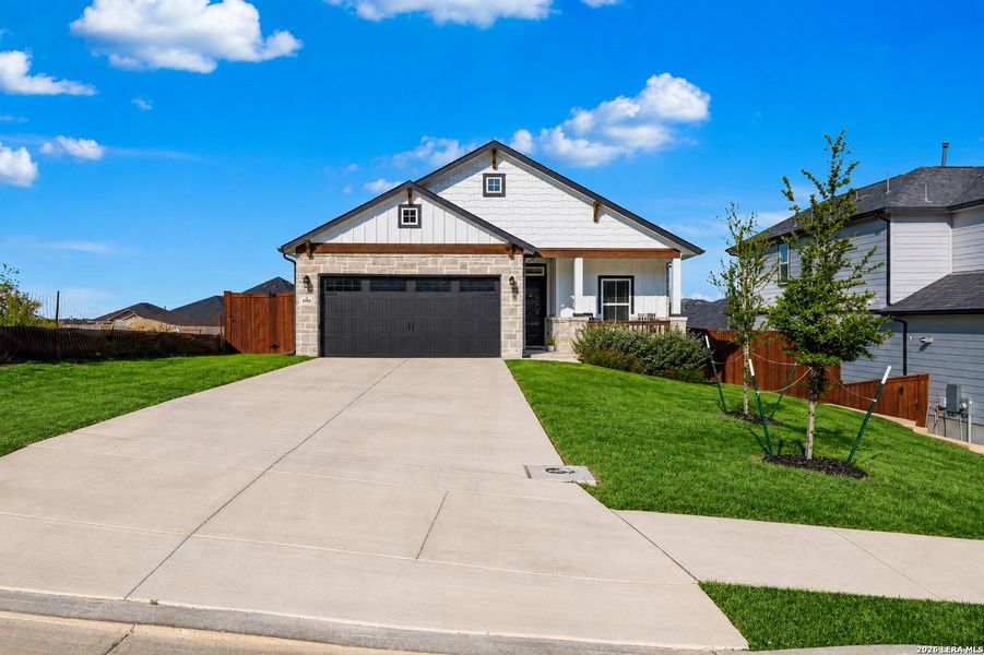 Front exterior of a new home in Homestead, Schertz, TX, highlighting curb appeal (Image 2). Front exterior of a new home in Homestead, Schertz, TX, highlighting curb appeal (Image 2).