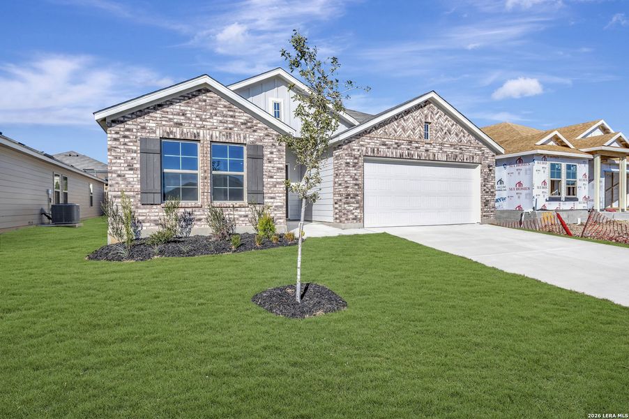 Front exterior of a new home in Greenspoint Heights, Seguin, TX, highlighting curb appeal (Image 20).