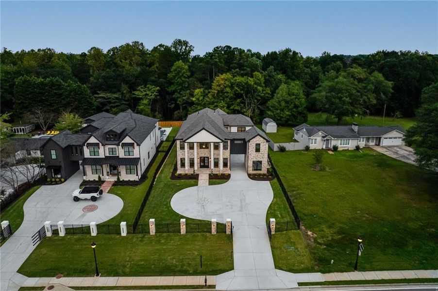 Front exterior of a new home in , Buford, GA, highlighting curb appeal (Image 29). Front exterior of a new home in , Buford, GA, highlighting curb appeal (Image 29).