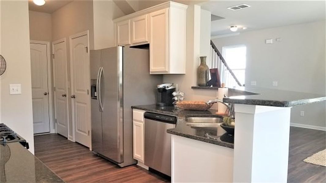 Representative furnished interior of a home built from the Emory by Piedmont Residential in Falls Creek, Flowery Branch (Image 13).