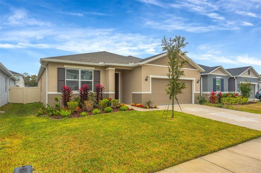 Front exterior of a new home in , Wesley Chapel, FL, highlighting curb appeal (Image 27). Front exterior of a new home in , Wesley Chapel, FL, highlighting curb appeal (Image 27).