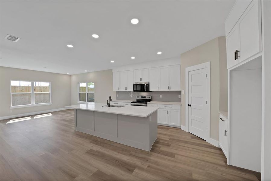 Furnished interior view inside a new home in , The Colony (Image 6).