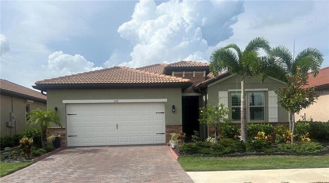Front exterior of a new home in , Nokomis, FL, highlighting curb appeal (Image 2). Front exterior of a new home in , Nokomis, FL, highlighting curb appeal (Image 2).