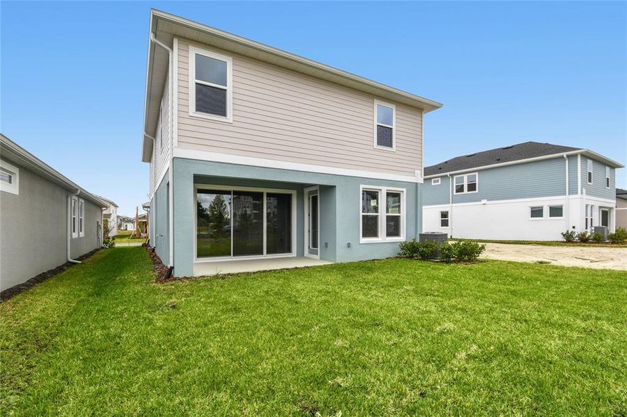 Exterior details and patio area of a home in Chapel Crossings - Garden Series, Wesley Chapel (Image 4).
