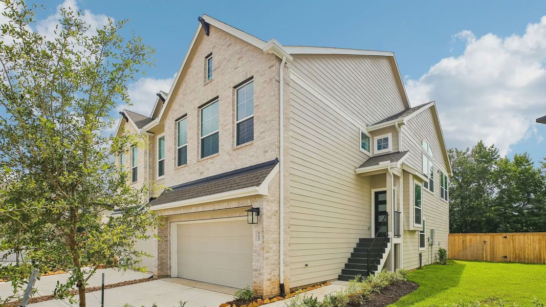 Front exterior of a new home in Woodforest, Montgomery, TX, highlighting curb appeal (Image 2). Front exterior of a new home in Woodforest, Montgomery, TX, highlighting curb appeal (Image 2).