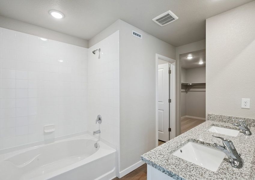 The master bathroom has a dual sink vanity and tub/shower combo. The master bathroom has a dual sink vanity and tub/shower combo.