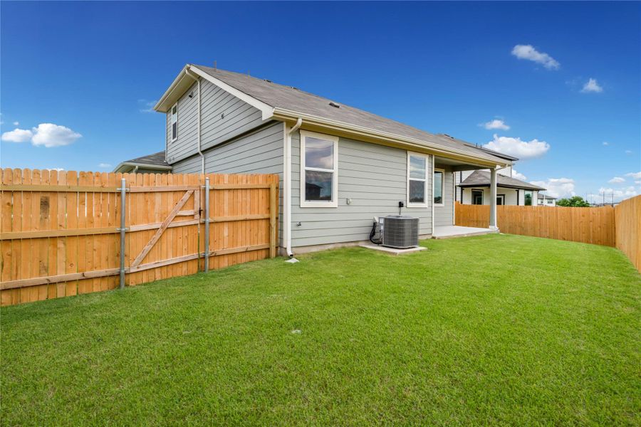 Front exterior of a new home in Talavera, Kyle, TX, highlighting curb appeal (Image 15). Front exterior of a new home in Talavera, Kyle, TX, highlighting curb appeal (Image 15).
