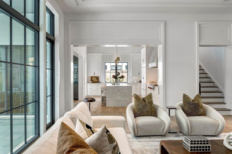 Open to the kitchen, the living room has great flow for entertaining with two glass doors opening to the covered patio.