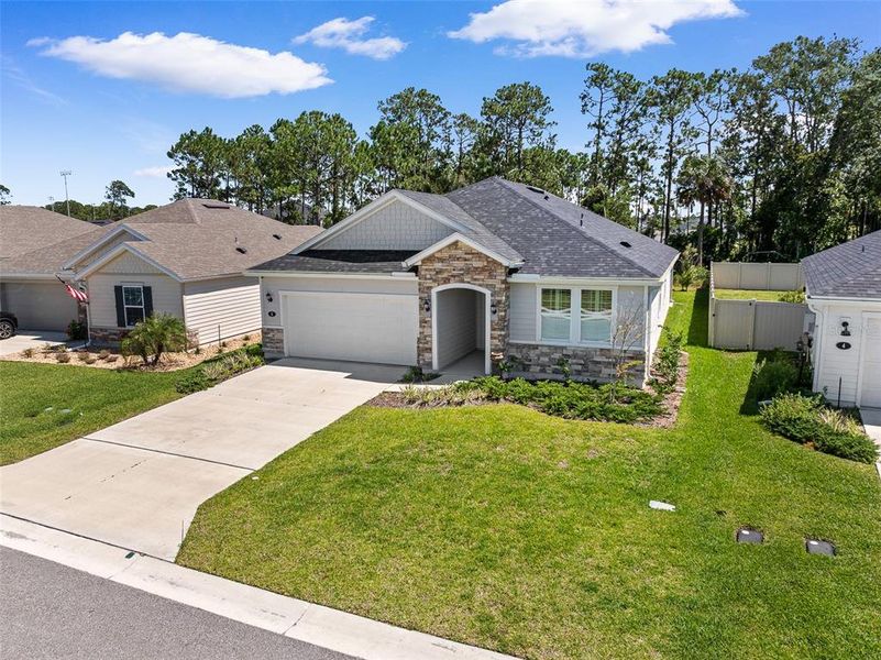 Front exterior of a new home in , Flagler Beach, FL, highlighting curb appeal (Image 27).