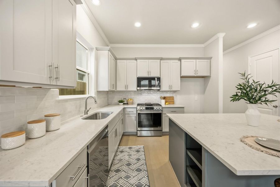 Culinary excellence awaits in a kitchen adorned with a large island, abundant quartz countertops, and ample space for two chefs to work together seamlessly. Enjoy the convenience of soft-close drawers and a waste bin pull-out, adding a touch of luxury to your cooking experience. Culinary excellence awaits in a kitchen adorned with a large island, abundant quartz countertops, and ample space for two chefs to work together seamlessly. Enjoy the convenience of soft-close drawers and a waste bin pull-out, adding a touch of luxury to your cooking experience.