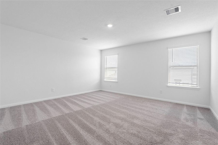 Relax and recharge in this stunning primary suite! This expansive room offers plush carpeting, custom neutral walls, high ceilings, and large windows fitted with privacy blinds—perfect for unwinding after a long day. Relax and recharge in this stunning primary suite! This expansive room offers plush carpeting, custom neutral walls, high ceilings, and large windows fitted with privacy blinds—perfect for unwinding after a long day.