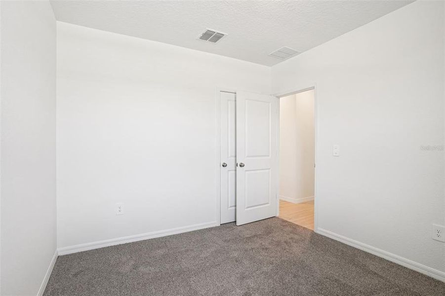 Spacious, unfurnished interior of a new home in Ridgehaven - Villas, Ormond Beach (Image 25).