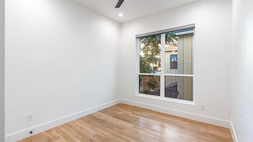 Spare room featuring light hardwood / wood-style floors and ceiling fan