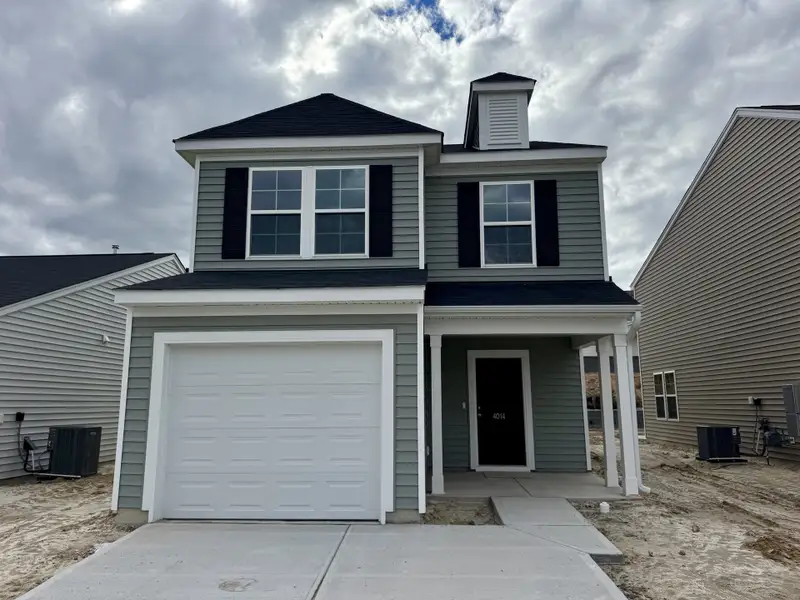 Front exterior of a new home in Ellington, Elgin, SC, highlighting curb appeal (Image 1). Front exterior of a new home in Ellington, Elgin, SC, highlighting curb appeal (Image 1).
