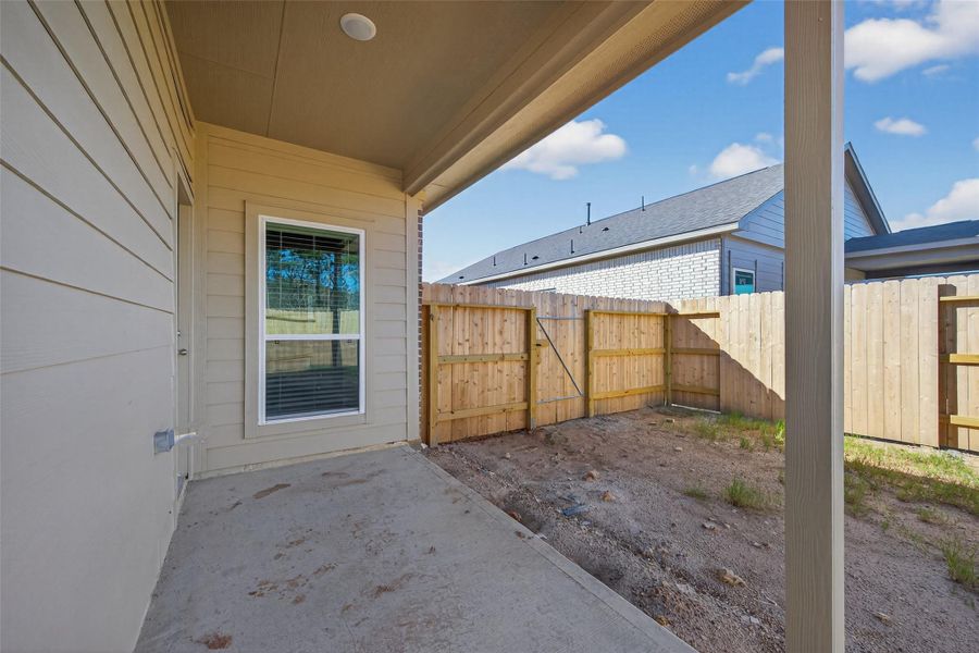 Exterior details and patio area of a home in Enclave at Willis, Willis (Image 22).