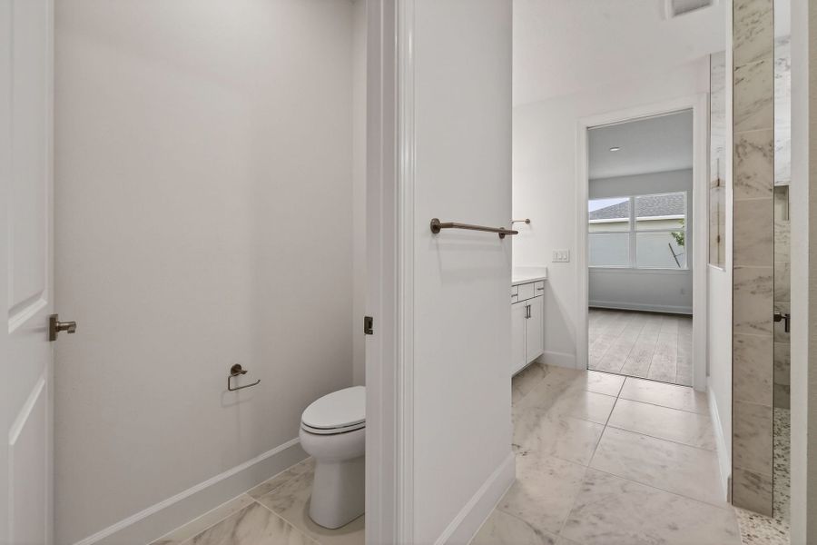 Furnished interior view inside a new home in Del Webb Tradition, Port St. Lucie (Image 16).