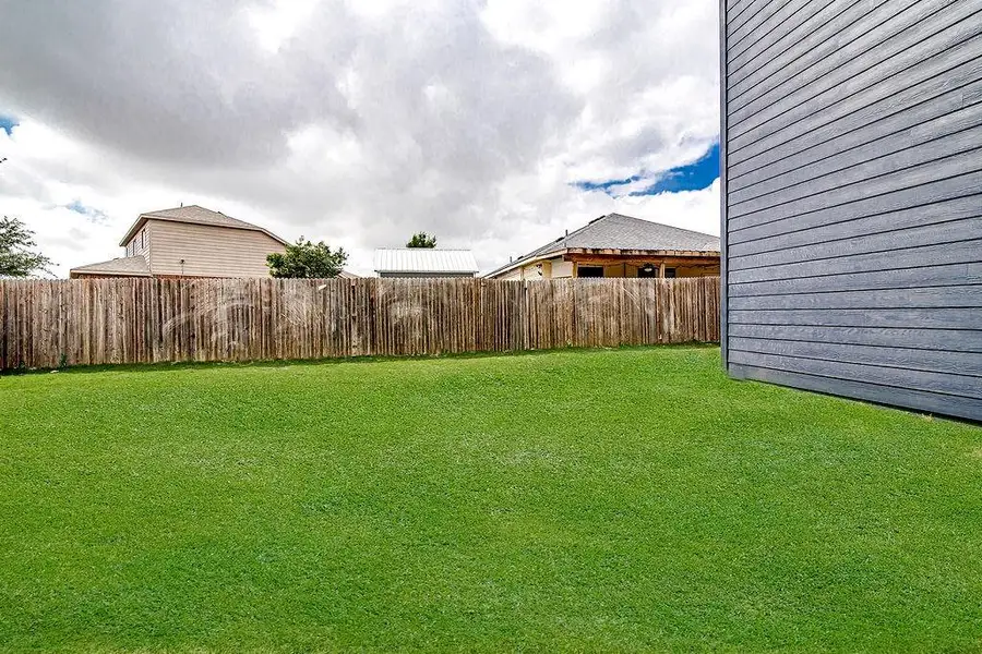Exterior details and patio area of a home in Trails of Fossil Creek, Fort Worth (Image 3).