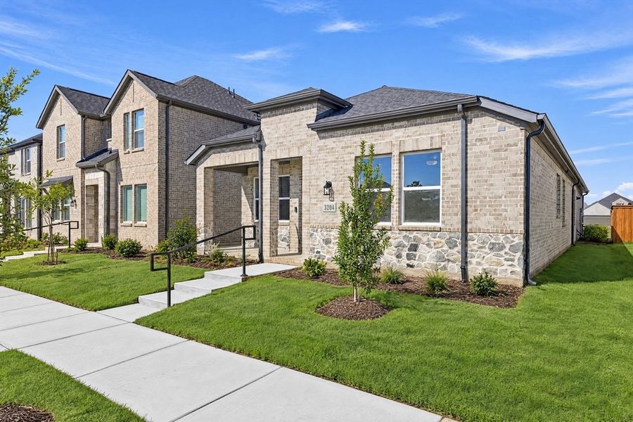 Front exterior of a new home in North Sky Celina, Celina, TX, highlighting curb appeal (Image 18). Front exterior of a new home in North Sky Celina, Celina, TX, highlighting curb appeal (Image 18).