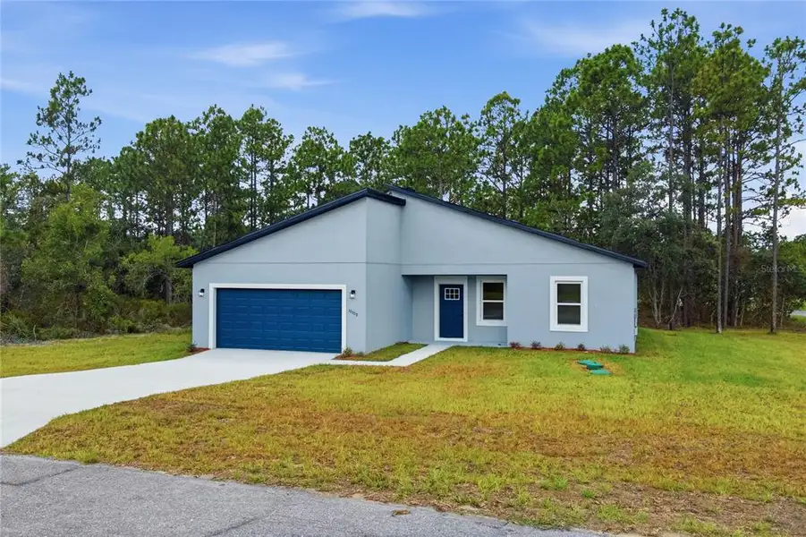 Front exterior of a new home in , Dunnellon, FL, highlighting curb appeal (Image 2). Front exterior of a new home in , Dunnellon, FL, highlighting curb appeal (Image 2).